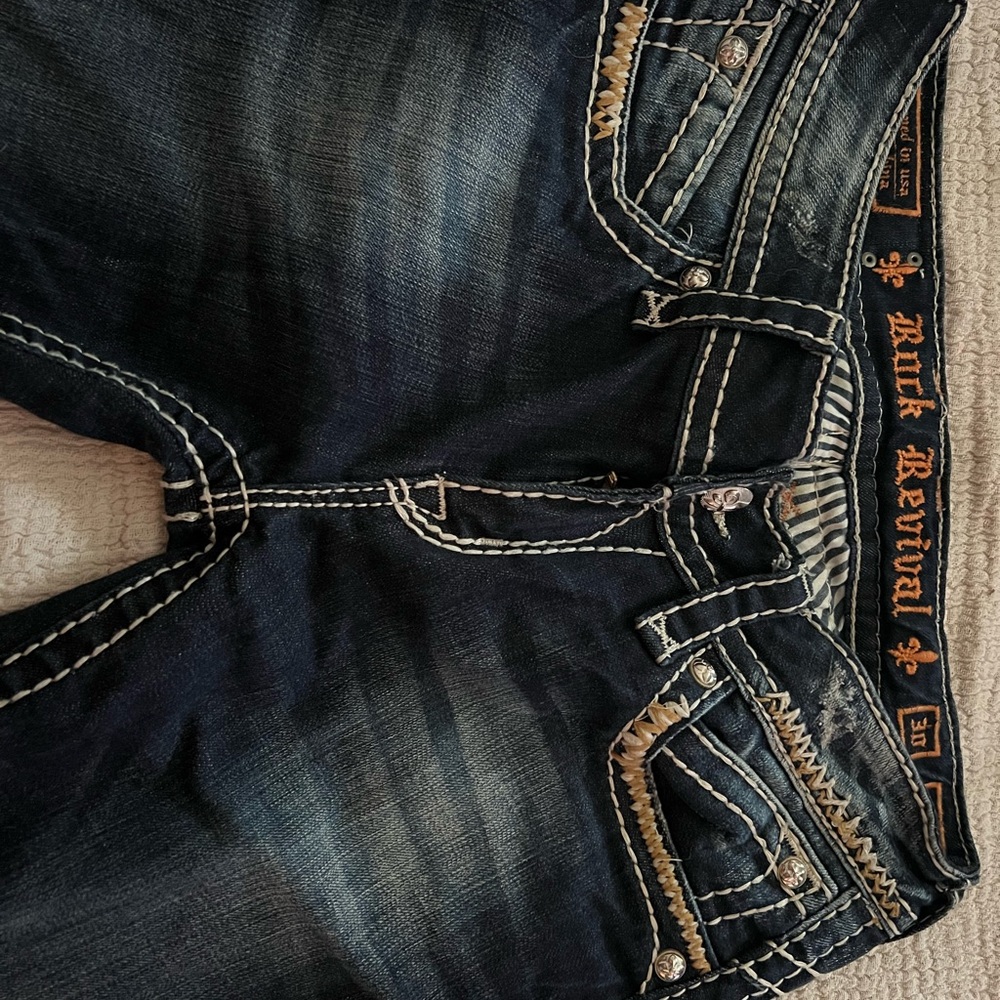 Rock Revival Blue Boot Cut Jeans with Distinctive Stitching